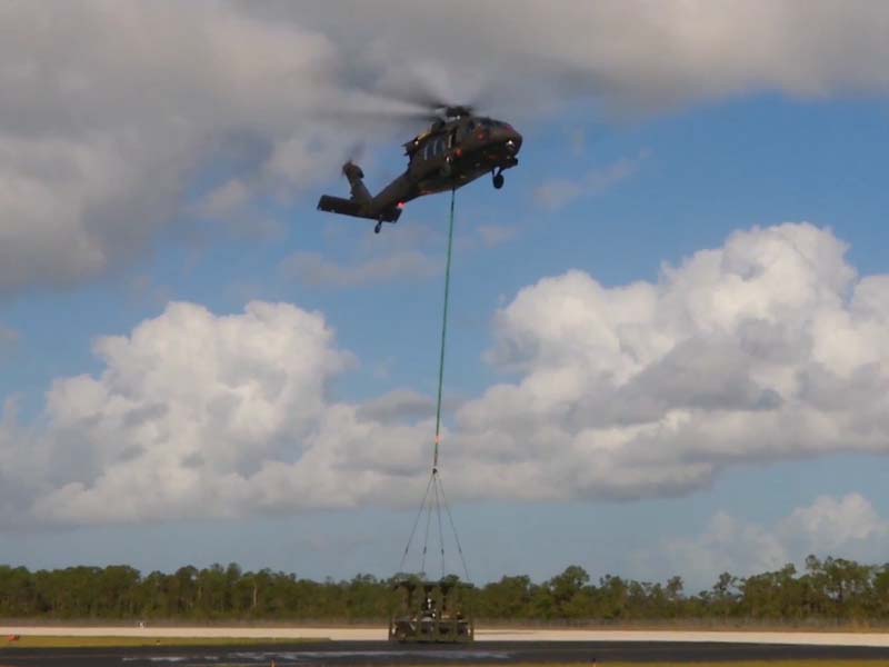 UAV helicopter transports a UGV vehicle at the National Robotics Engineering Center (NREC). 